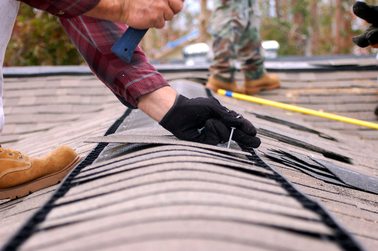 Person repairing roof